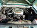 1964 Mercury Comet - The engine bay of a 1964 Mercury Comet shows its V8 engine, air cleaner assembly, and radiator.