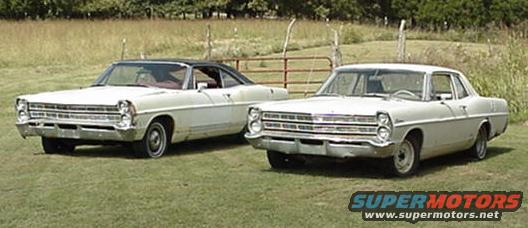 Two white Ford sedans parked on grass, one with a black vinyl roof