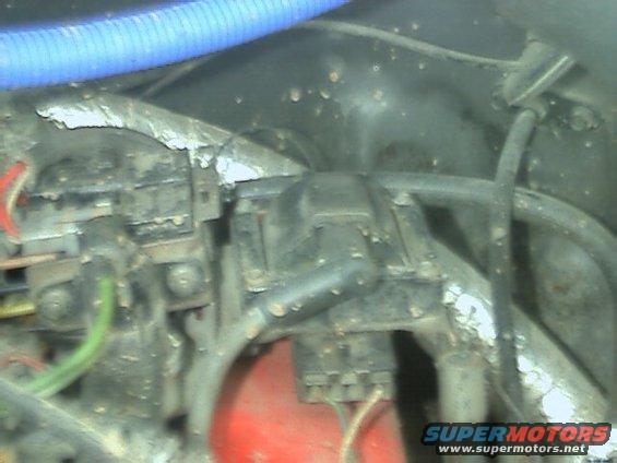 Engine distributor cap and wires with blue hose above
