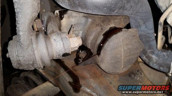 View from underneath the truck.  The 2-bolt steering gear is still in place, and the suspension components are still attached.
