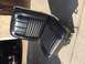 1967 Ford Fairlane - A black vinyl car seat with distinctive stitching patterns is shown, detached from a vehicle.