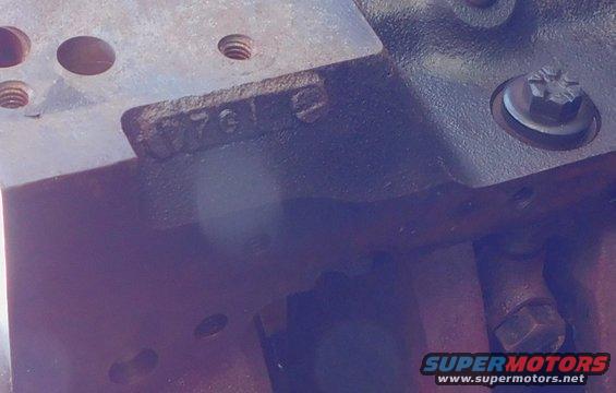 Close-up of engine block with stamped numbers '7612'
