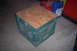 1995 Ford Bronco - A homemade stool constructed from a milk crate and a piece of plywood sits on a concrete floor.