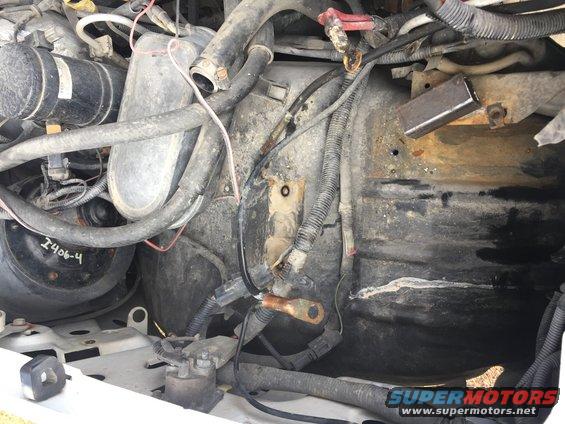 Engine bay showing dual batteries and wiring