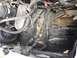 1996 Ford Bronco - Close-up view of the engine bay, highlighting the dual battery setup and associated wiring.