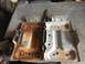 1996 Ford Bronco - Comparison of a rusty and a clean dual battery tray, possibly for a vehicle.
