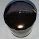 2000 Ford Crown Victoria - A black oil filter is shown with a date and time stamped on its surface.