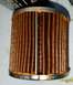 2000 Ford Crown Victoria - This oil filter shows signs of use with its pleated element and sealant.