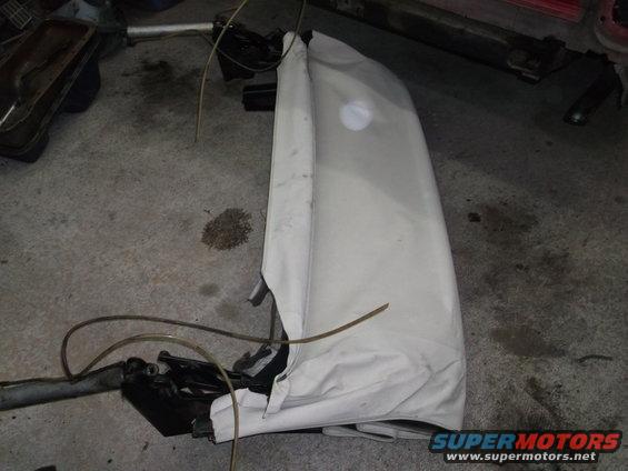White convertible top folded and covered