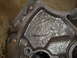 1969 Ford Mustang - This is a close-up view of a cast iron engine block, showing its textured surface and oil residue. The registry claims it is a 1969 Ford Mu…