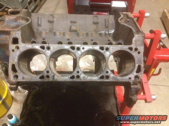 Engine block on a stand, showing cylinder bores