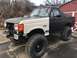1989 Ford Bronco - This lifted 1989 Ford Bronco features a two-tone paint scheme and aggressive off-road tires.