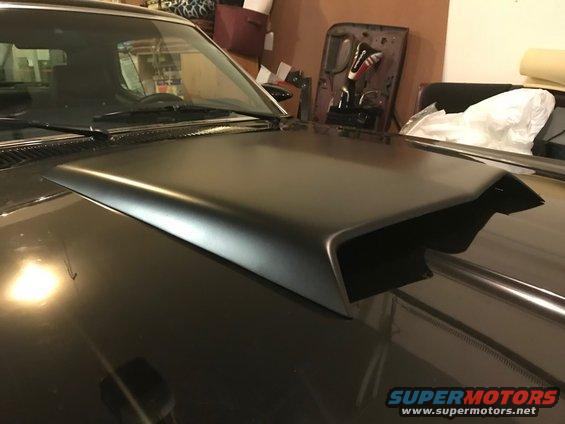 Black hood scoop on a dark car