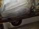 1998 Lincoln Mark VIII - Underside view of a vehicle's fuel tank and exhaust pipe.
