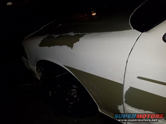 White 2003 Ford Crown Victoria side view with peeling paint on fender and door