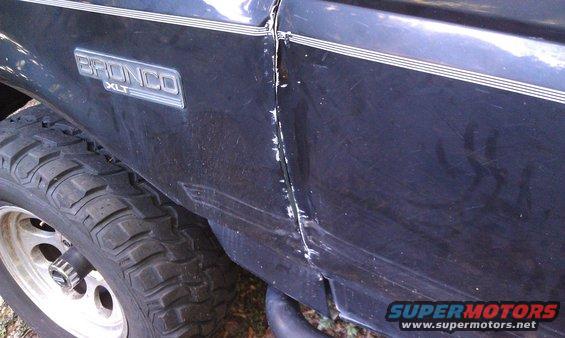 Dented door and fender