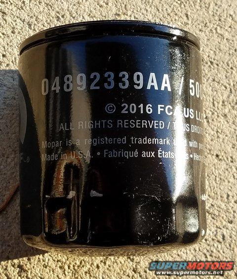 Black oil filter with part number 04892339AA and copyright 2016