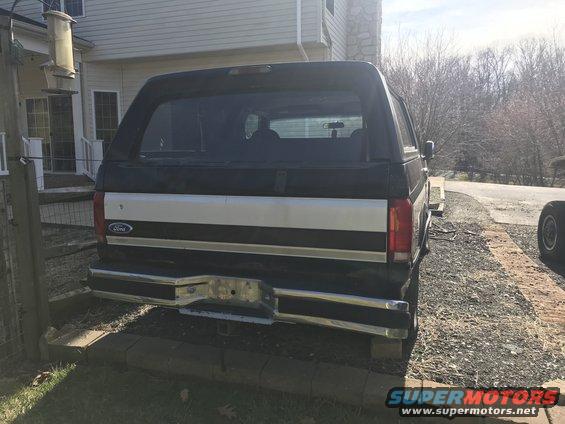 1992 Ford Bronco rear view with black and silver two-tone paint and chrome bumper