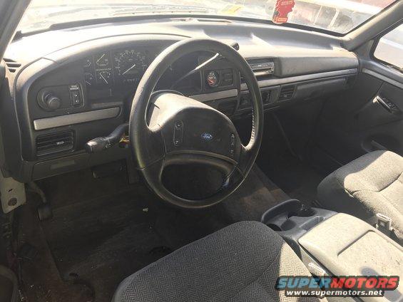 1992 Ford Bronco interior showing dashboard, steering wheel, and seats