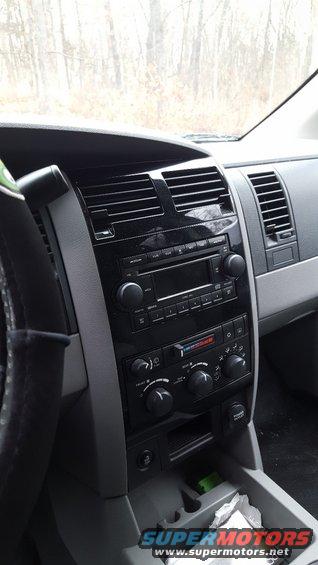 Dashboard of a 2007 Dodge Durango with a black center console, radio, and climate controls