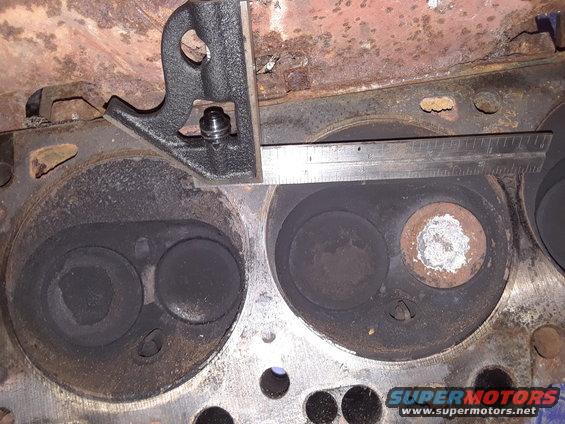 Engine cylinder head with ruler and square measuring valve depth