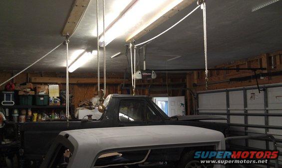 Dark truck cab and white hood in garage
