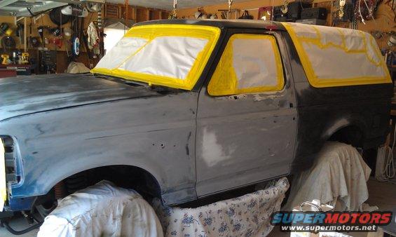 1995 Ford Bronco bodywork in progress, windows taped off for paint