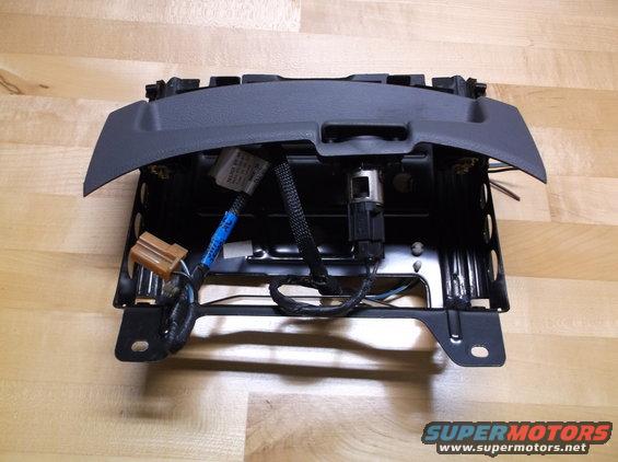 Center console part with wiring harness and connectors