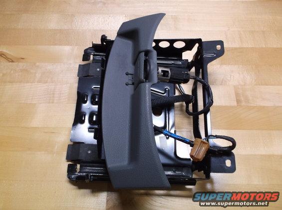 Car seat frame with gray plastic trim and wiring harness