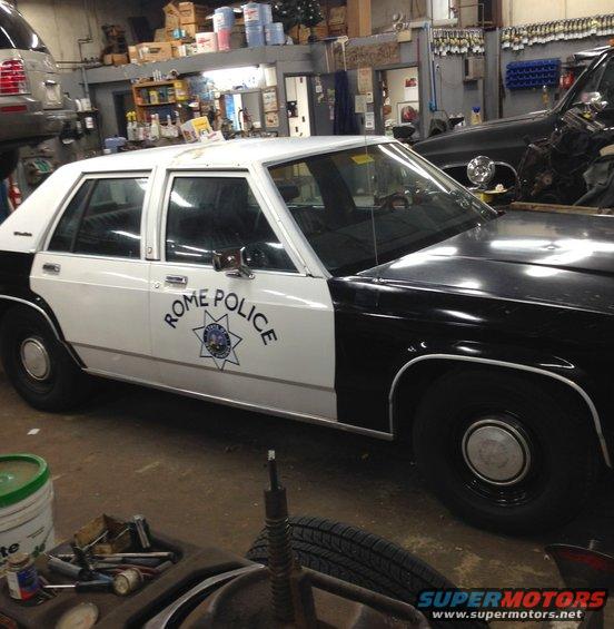 1988 Ford Crown Victoria LTD police car with 'ROME POLICE' text on the door