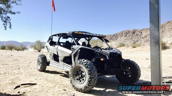 Side-by-side off-road vehicle in desert landscape