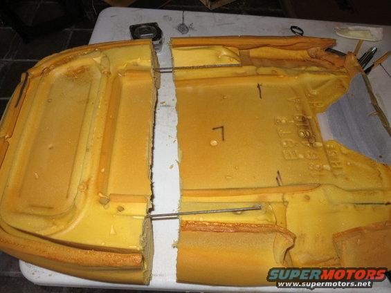 Cut seat foam with visible markings and SuperMotors.net logo