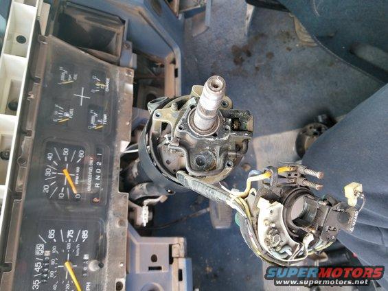 disassembled steering column and dashboard gauges