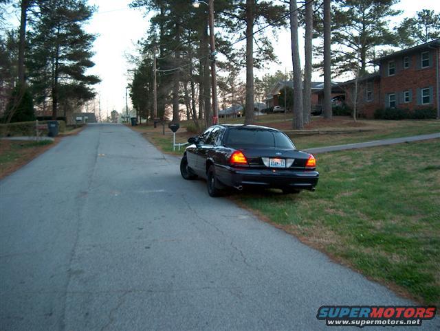 2001 Ford Crown Victoria parked on the side of a street, rear view