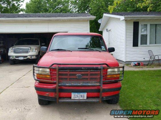 Red 1996 Ford Bronco front view with brush guard and license plate 224 YKG