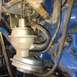 1979 Ford Ranchero - This image shows a close-up view of a vacuum diaphragm and associated hoses within an engine compartment.