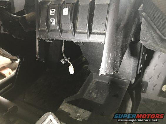 Dashboard interior with four-wheel drive selector buttons and exposed wiring