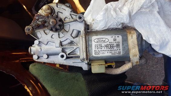Ford window motor assembly with part number F6TB-14A366-AA and date code 19 12 95