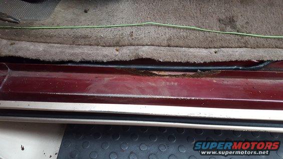 1967 Ford Bronco interior door sill showing rust
