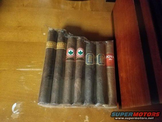Package of seven cigars with various bands including Joya de Nicaragua and Joya Red