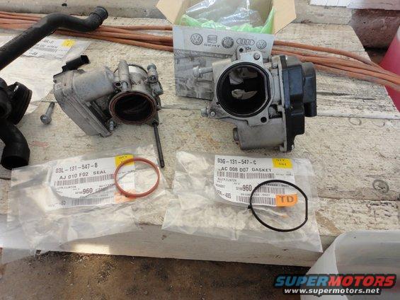 Throttle body and new gaskets with part numbers visible