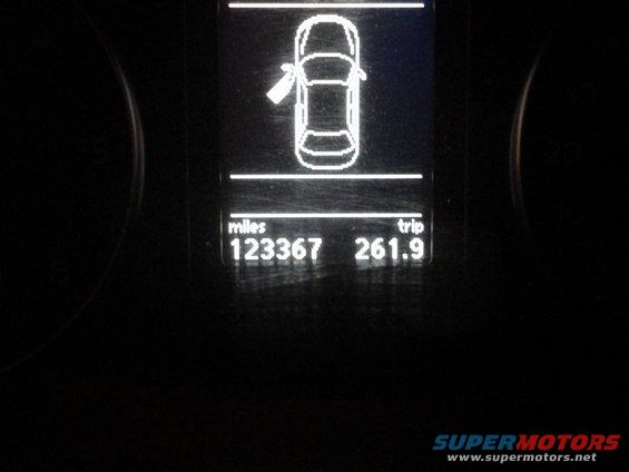 Car dashboard shows 123367 miles and 261.9 trip miles