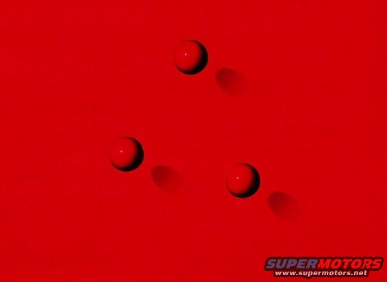 three red spheres casting shadows on a red surface