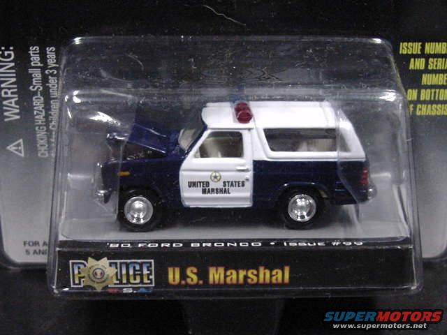 Toy 1980 Ford Bronco police car with 'United States Marshal' text on the side, in packaging