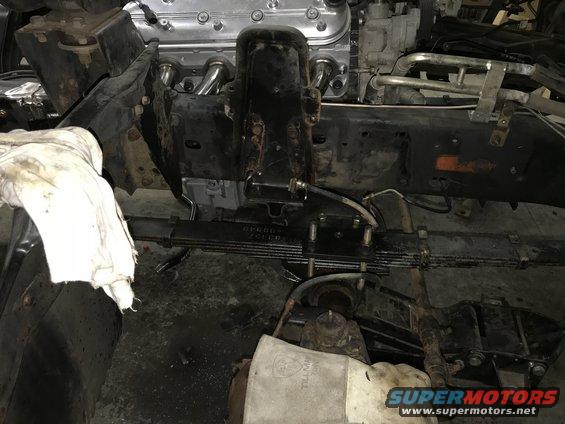 Truck frame with leaf springs and a V8 engine installed