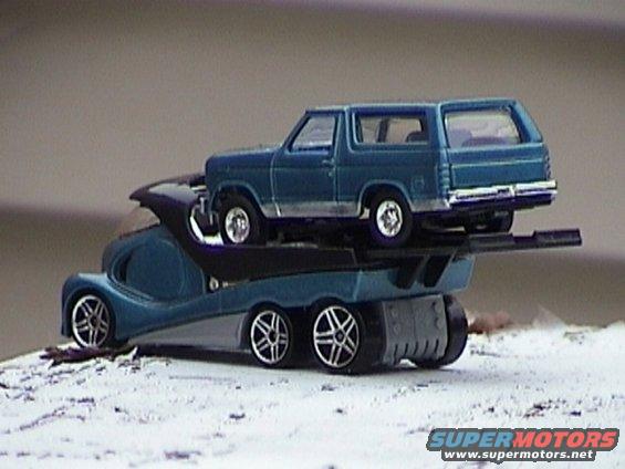 Blue 1979 Ford Bronco on a tow truck