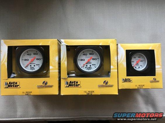 Three Auto Meter gauges: oil pressure, fuel pressure, and oil pressure
