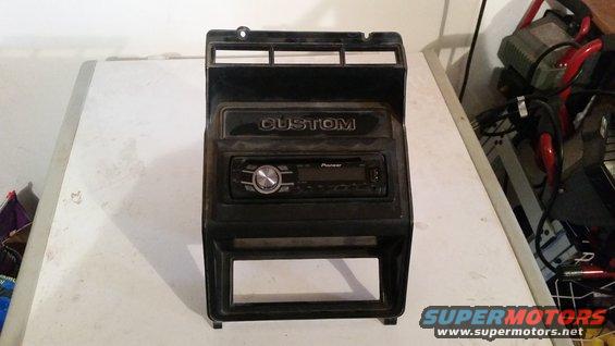 Dashboard speaker install panel with Pioneer radio and "CUSTOM" text