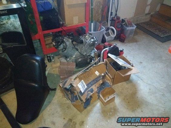 3.jpg The engine and more boxes of parts. Great seat also shown.