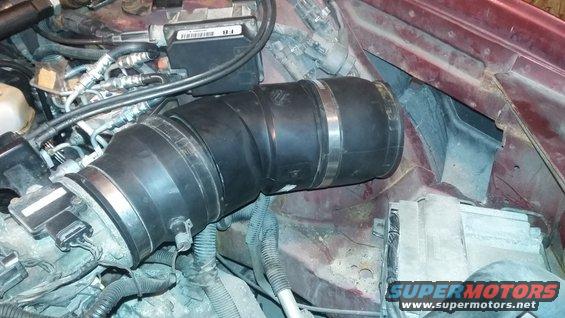 Engine intake tube with metal clamps